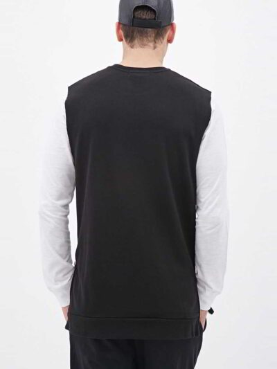 Sleeveless black hoodie. Close-up shows textured fabric, durable stitching. Custom cut & sew design. Athletic, modern menswea