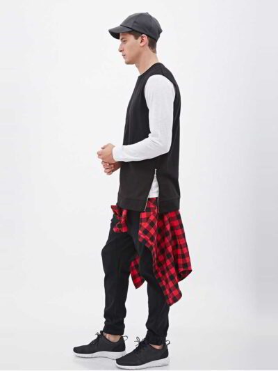 Sleeveless black hoodie. Close-up shows textured fabric, durable stitching. Custom cut & sew design. Athletic, modern menswea