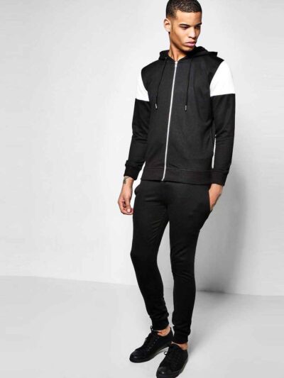 Custom tracksuit showcasing panel design. Soft, brushed fabric, neat stitching. Contrasting colors highlight the modern silho