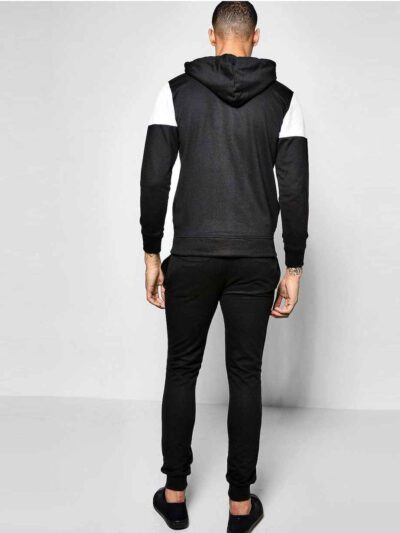 Custom tracksuit showcasing panel design. Soft, brushed fabric, neat stitching. Contrasting colors highlight the modern silho