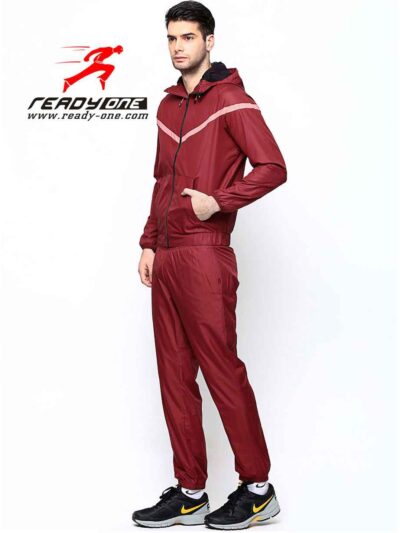 Crimson & black sports tracksuit; performance fabric, subtle stitching, comfortable fit. Ideal for custom athletic apparel pr