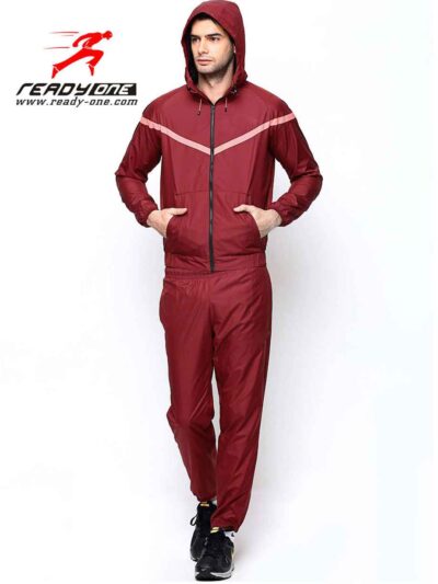 Crimson & black sports tracksuit; performance fabric, subtle stitching, comfortable fit. Ideal for custom athletic apparel pr