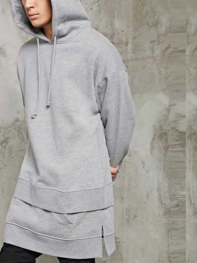 Premium longline hoodie in black cotton with front kangaroo pocket and ribbed cuffs