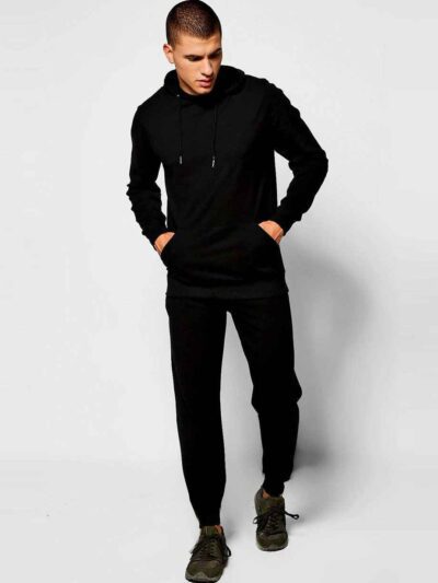 Slim athletic tracksuit. Close-up shows fine stitching, smooth fabric texture; hints of deep blues and charcoal grey. Streaml