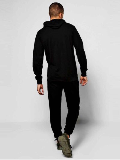 Slim athletic tracksuit. Close-up shows fine stitching, smooth fabric texture; hints of deep blues and charcoal grey. Streaml