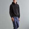 Soft black hoodie with kangaroo pocket and ribbed cuffs in heavyweight cotton fabric