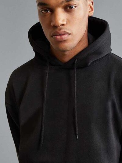 Premium black hoodie with kangaroo pocket and ribbed cuffs in heavyweight cotton fabric