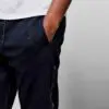 High GSM streetwear tracksuit: short-sleeve t-shirt and shorts. Thick fabric, visible stitching. Casual, comfortable fit. Hin