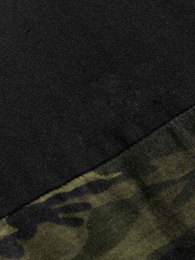 Men's crew neck tee featuring a color block camo pattern with bold letter graphics. Soft, breathable 100% cotton with clean s
