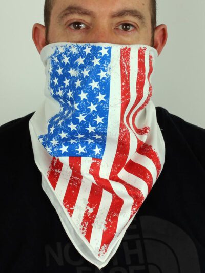 White bandana face mask printed with the American flag. Soft fabric, subtle stitching detail. Patriotic face covering. - View