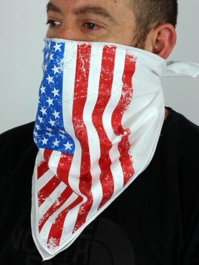 White bandana face mask printed with the American flag. Soft fabric, subtle stitching detail. Patriotic face covering. - View