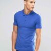 Close-up of a polo shirt, wrinkle-resistant fabric, fine stitching, subtle texture, workwear style in a light blue hue. Comfo