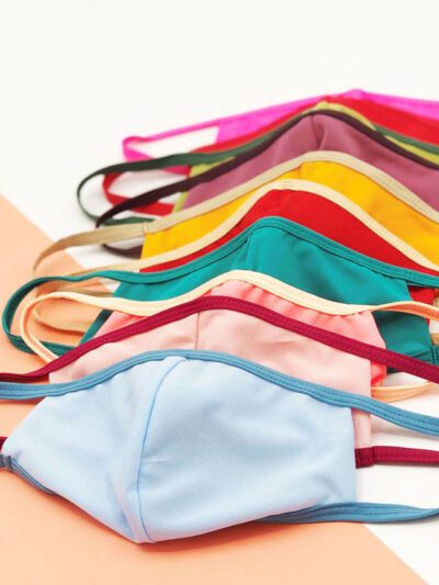 Vibrant assorted face masks. Soft, breathable fabric, meticulous stitching. Reusable cloth masks in blue, pink, and yellow hu