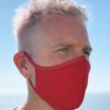 Vibrant assorted face masks. Soft, breathable fabric, meticulous stitching. Reusable cloth masks in blue, pink, and yellow hu