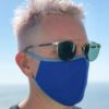 Vibrant assorted face masks. Soft, breathable fabric, meticulous stitching. Reusable cloth masks in blue, pink, and yellow hu