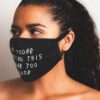 Close-up: Black fabric face mask with custom print. Soft, textured material, clean stitching. Daily use, unisex design. - Vie