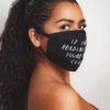 Close-up: Black fabric face mask with custom print. Soft, textured material, clean stitching. Daily use, unisex design. - Vie