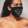 Close-up: Black fabric face mask with custom print. Soft, textured material, clean stitching. Daily use, unisex design. - Vie