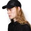 Black leather baseball cap: deep, rich texture, precision stitching. Stylish and durable sports headwear. Premium quality con
