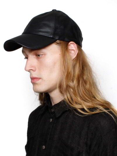 Black leather baseball cap: deep, rich texture, precision stitching. Stylish and durable sports headwear. Premium quality con