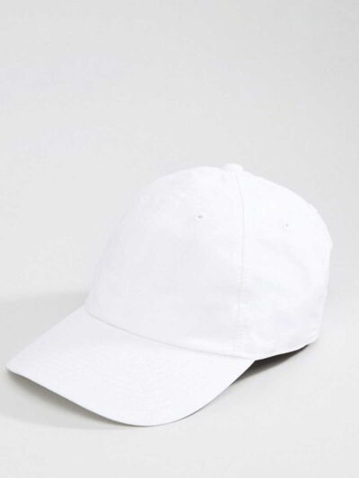 Close-up of a blank polo cap in a light color. Notice the fine pique knit fabric texture and reinforced stitching details at