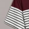 Boy's tee: bold stripes of blue, orange, and gray. Soft knit fabric, durable seams. Casual style for everyday wear, vibrant &