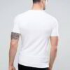 Close-up of folded, blank t-shirts. Smooth, fine knit fabric, even stitching. Premium feel. Ideal for printing. Vibrant color