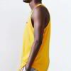Close-up of blank cotton singlets, showcasing soft knit texture & clean stitching. Perfect for printing, hinting at various c