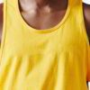 Close-up of blank cotton singlets, showcasing soft knit texture & clean stitching. Perfect for printing, hinting at various c