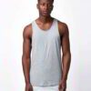 Close-up of bulk cotton tank tops showing soft, breathable knit fabric. Fine stitching detail, ideal for layering or summer w