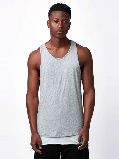 Close-up of bulk cotton tank tops showing soft, breathable knit fabric. Fine stitching detail, ideal for layering or summer w