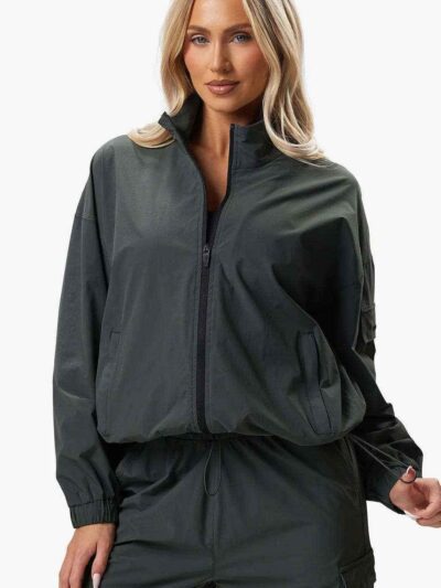Women's velour tracksuit set, custom embroidered. Soft, plush cotton texture. Note delicate stitching detail on the jacket an