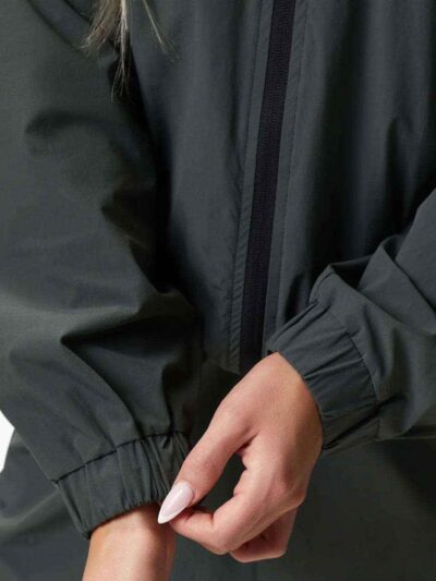 Women's velour tracksuit set, custom embroidered. Soft, plush cotton texture. Note delicate stitching detail on the jacket an