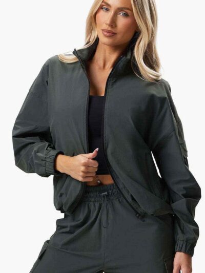 Women's velour tracksuit set, custom embroidered. Soft, plush cotton texture. Note delicate stitching detail on the jacket an