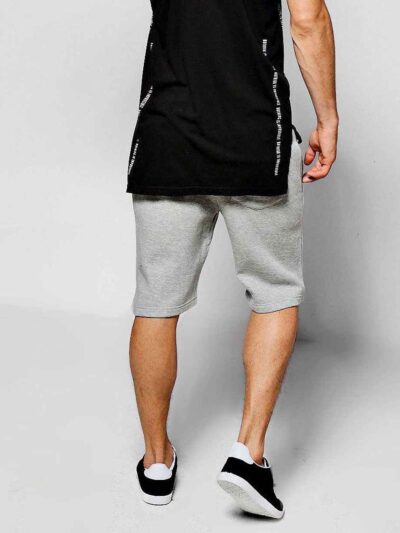 Lightweight summer shorts with clean stitching. Close-up showing soft fabric texture and potential for custom logo placement.