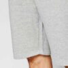 Lightweight summer shorts with clean stitching. Close-up showing soft fabric texture and potential for custom logo placement.