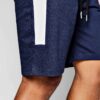 Close-up of black workout shorts; tailored fit, clean stitching, breathable performance fabric. Perfect for customized corpor