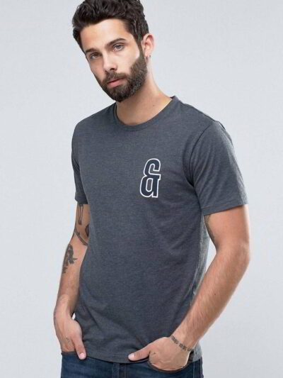 Close-up of custom printed apparel. Soft cotton blend, fine stitching, vibrant graphic. Crew neck tee hints of navy, exceptio