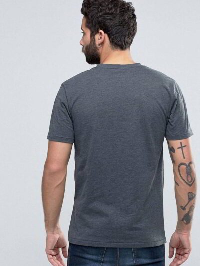 Close-up of custom printed apparel. Soft cotton blend, fine stitching, vibrant graphic. Crew neck tee hints of navy, exceptio