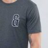 Close-up of custom printed apparel. Soft cotton blend, fine stitching, vibrant graphic. Crew neck tee hints of navy, exceptio