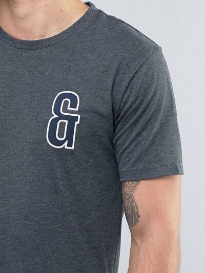Close-up of custom printed apparel. Soft cotton blend, fine stitching, vibrant graphic. Crew neck tee hints of navy, exceptio