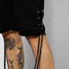 Close-up of athletic shorts: breathable knit fabric, reinforced stitching. Perfect for university teams, shown in school colo