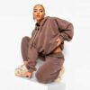 Luxury women's tracksuits in bulk. Soft, textured fabric. Fine stitching, premium feel. Loungewear sets in various muted tone