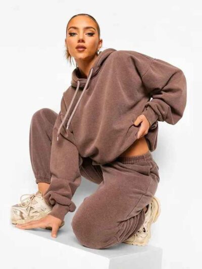 Luxury women's tracksuits in bulk. Soft, textured fabric. Fine stitching, premium feel. Loungewear sets in various muted tone