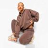 Luxury women's tracksuits in bulk. Soft, textured fabric. Fine stitching, premium feel. Loungewear sets in various muted tone
