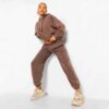 Luxury women's tracksuits in bulk. Soft, textured fabric. Fine stitching, premium feel. Loungewear sets in various muted tone