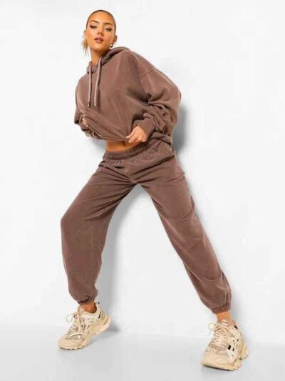 Luxury women's tracksuits in bulk. Soft, textured fabric. Fine stitching, premium feel. Loungewear sets in various muted tone