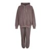 Luxury women's tracksuits in bulk. Soft, textured fabric. Fine stitching, premium feel. Loungewear sets in various muted tone