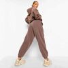 Luxury women's tracksuits in bulk. Soft, textured fabric. Fine stitching, premium feel. Loungewear sets in various muted tone