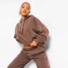 Luxury women's tracksuits in bulk. Soft, textured fabric. Fine stitching, premium feel. Loungewear sets in various muted tone
